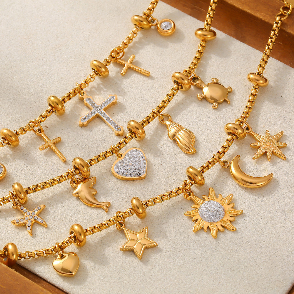 Bracelet Océan d'Or  Acier inoxydable doré, charms marins et cœur diamanté