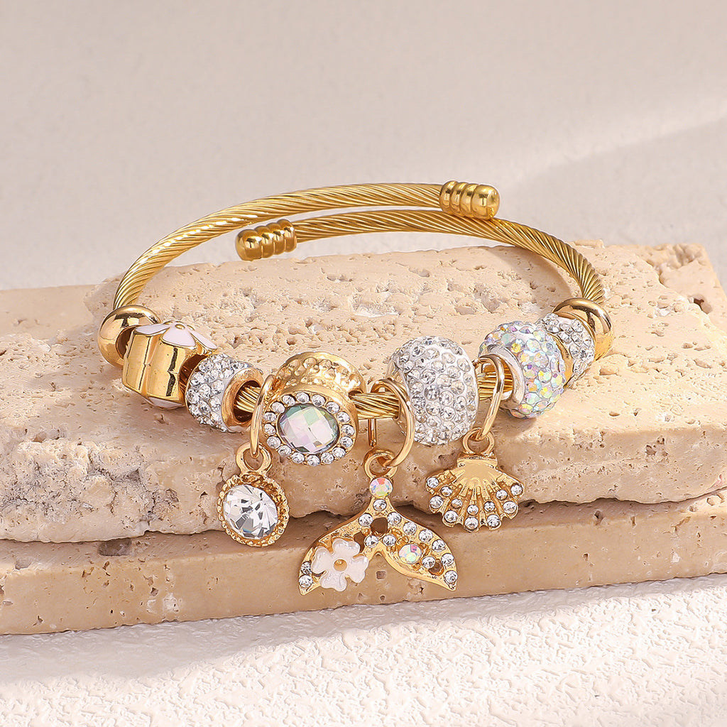 Bracelet femme en acier inoxydable doré  Charms coquillage & queue de poisson