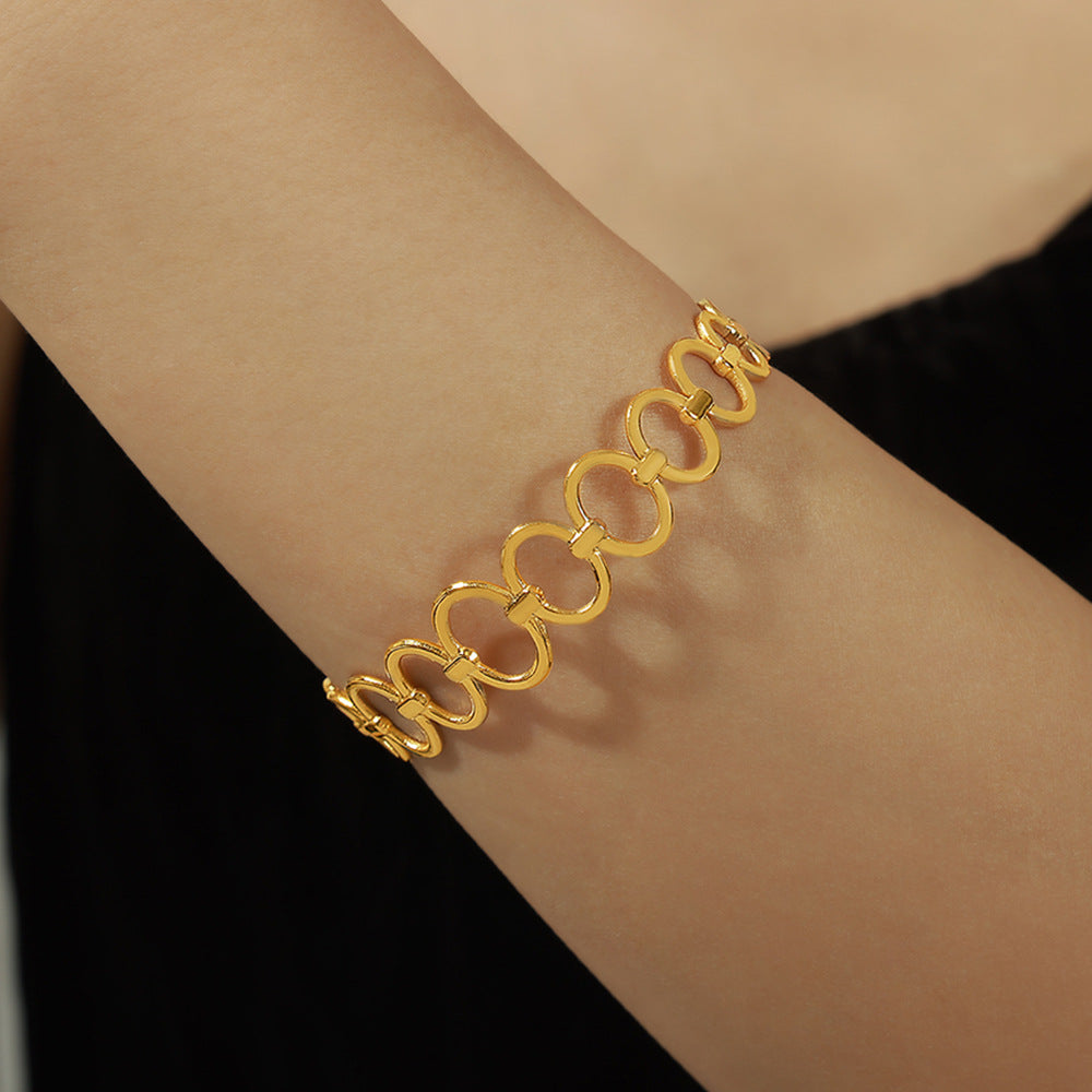 Bracelet Éclat d'Or  Acier inoxydable doré, design géométrique ajouré