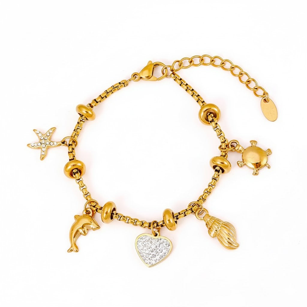 Bracelet Océan d'Or  Acier inoxydable doré, charms marins et cœur diamanté